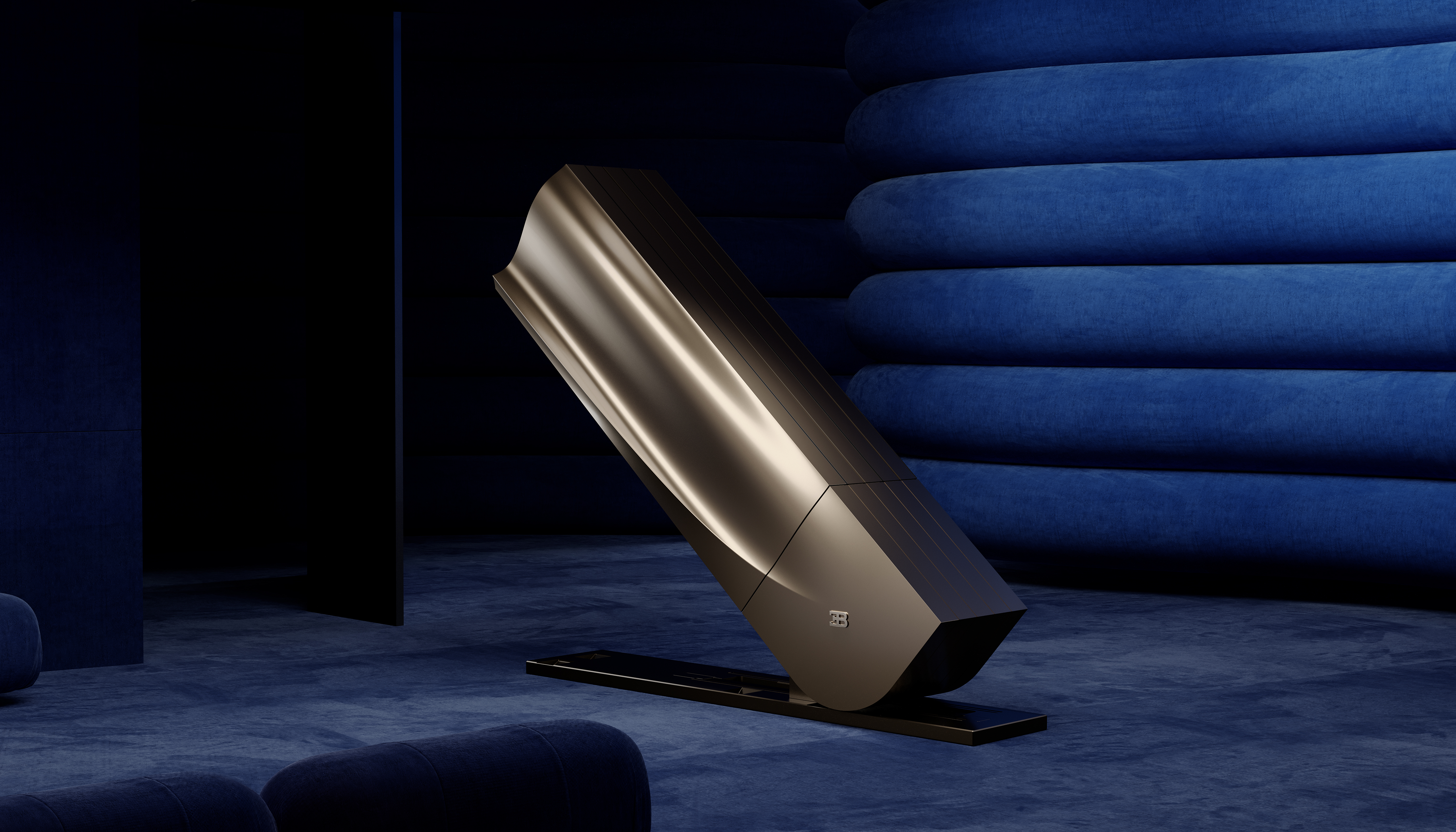 a large, champagne-colored, sculptural object with a curved, modern design rests on a dark base in a dimly lit room with dark blue, horizontally ribbed walls.